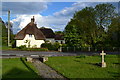 Thatched cottage opposite the church at Lytchett Minster