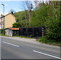 Metal buildings alongside the A4046 in Cwm