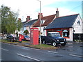 Elizabeth II postbox and telephone box on The Street. Kirby-le-Soken