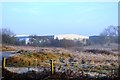 Rough grassland and industrial unit