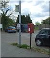 Elizabeth II postbox and bus stop on Shop Road, Little Bentley