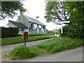 Cottage at junction with post box