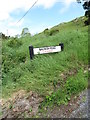 Road name plaque at the north end of Macinish Road