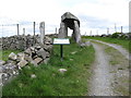 Legananny Dolmen and information board seen from the approach track