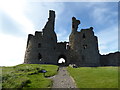 NU2521 : Dunstanburgh Castle by PAUL FARMER