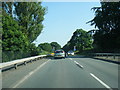 Whitegate Road crossing the A556