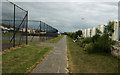 A path between the games courts and the beach