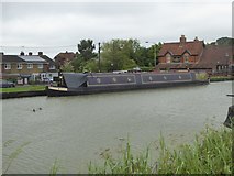 ST9961 : Canal narrow boat and the Black Horse inn by David Smith