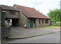 House with a low pitched roof,  Nibley Lane, Nibley, South Gloucestershire