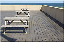 NZ6025 : Cafe tables - Redcar seafront by Stephen McKay