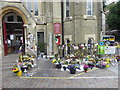 Flowers and candles outside Notting Hill Methodist Church