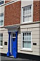 Blue door and white windows