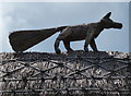 Fox on a thatched roof