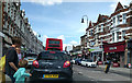 Shops, traffic and pedestrians in Muswell Hill