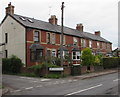 Row of brick houses and a telecoms cabinet, Hereford Road, Mardy