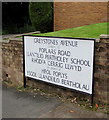 Large bilingual name sign on a Mardy corner