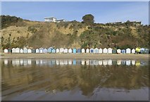 SZ5983 : Sandown beach huts at low tide by Paul Coueslant