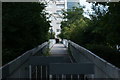 View along the footbridge connecting Sir John Mcdougall Gardens with the Quarterdeck development