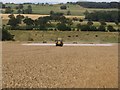 NZ1488 : Spraying wheat at Maidens Hall by Graham Robson