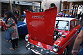 View of a Ford Anglia with its bonnet open in Greenwich Market for the Mean Old Timers meet-up