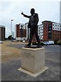 TL1997 : Chris Turner statue at London Road, Peterborough by Richard Humphrey