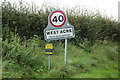 TF7715 : West Acre Village name sign on River Road by Geographer