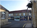 Approaching some shops in the Market Place