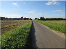 TG1119 : Road to Church Farm by Hugh Venables
