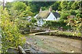 Ford, footbridge and thatched cottage at Helford, Cornwall