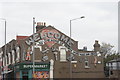 View of street art on the side of a small supermarket on Blackhorse Lane from outside Blackhorse Road station