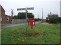 Elizabeth II postbox and signpost, Shammer