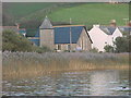 Looking across Slapton Ley to a church