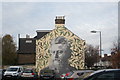 View of William Morris street art on the side of a house on Bedford Road from the Bedford Road car park