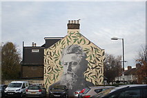 TQ3789 : View of William Morris street art on the side of a house on Bedford Road from the Bedford Road car park by Robert Lamb