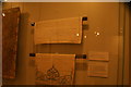 View of a tablecloth and sofa back in the William Morris Gallery