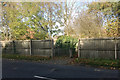 A way through the fence on the north side of Fields Farm Road, Long Eaton