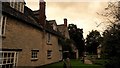 Houses by Ducklington churchyard