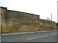 Eroded stone wall on Armley Ridge Road