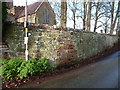 SO7584 : Sandstone walls on the east side of the churchyard by Richard Law