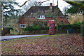 Former telephone box and cottage