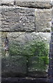 Benchmark on Skipton Road wall at Stoneycroft Lane junction