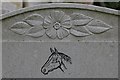 Horse on the headstone