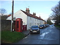 Telephone box and cottages on Seaton Road, Bewholme