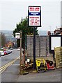 Bus stop & store sign outside 70 Castle Road, Cookley, Worcs