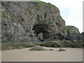 NO6952 : Natural arch, in volcanic rock, at Lunan Bay by Adrian Diack