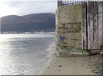 J3831 : Gentle waves lapping around the base of the former WWII pillbox at the Slieve Donard Hotel by Eric Jones