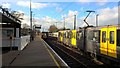 Newcastle Airport Metro trains cross at Kenton Bankfoot station