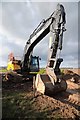 SO8541 : Excavator at Cemex quarry, Ryall Court Farm by Philip Halling
