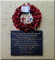 Poppy wreath and plaque under Lichfield City railway station