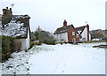 TL4052 : Haslingfield churchyard in the snow by John Sutton
